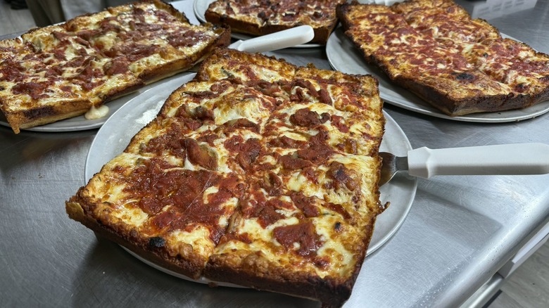 Detroit-style pizzas on metal pans at Loui's Pizza