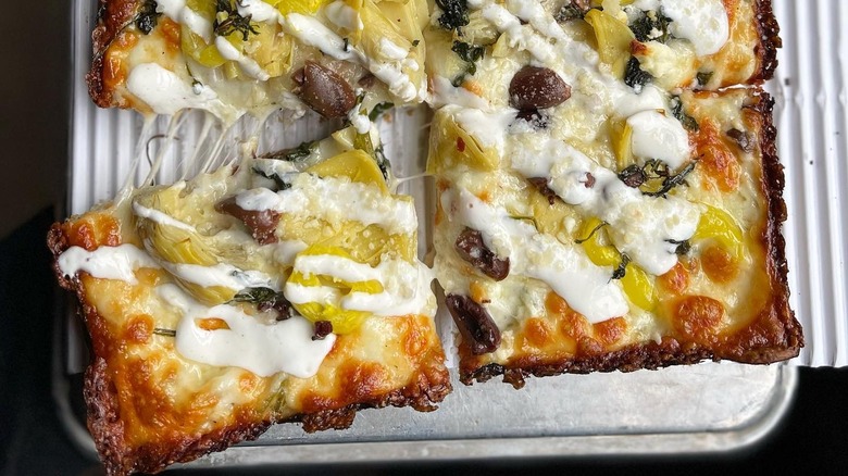 Slices of a Detroit-style pizza at Michigan & Trumbull