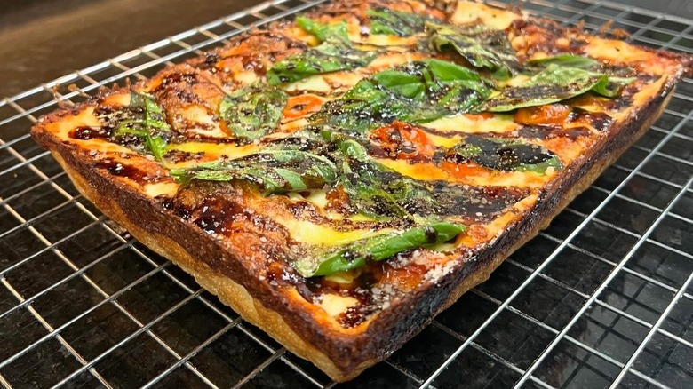 A Detroit-style pizza on a tray at Palazzo Di Pizza
