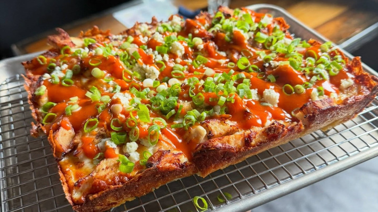 A Detroit-style pizza on a tray at Sharpies Pizza & Cocktails