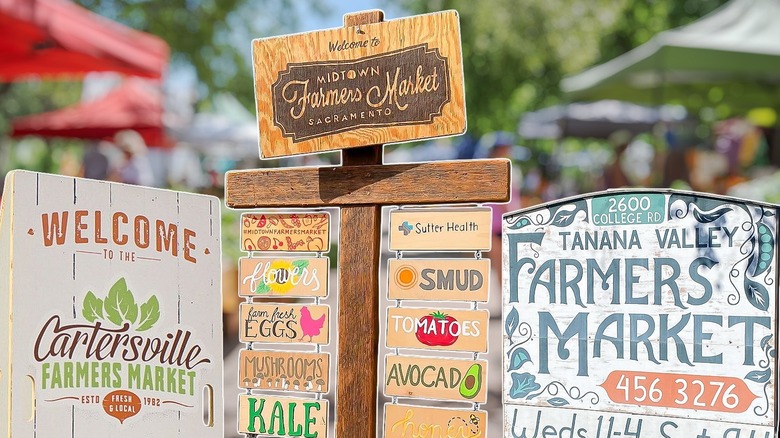Three farmers market signs