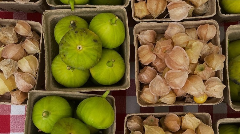 Boxes of eggplant and gooseberries at the Portland Farmers Market