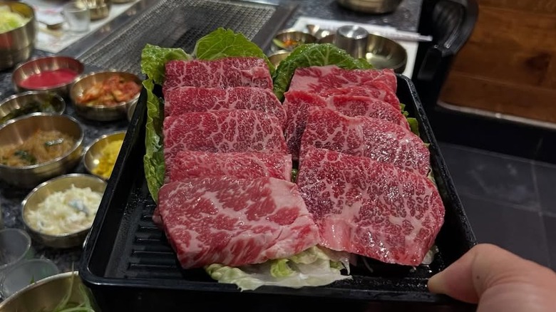 Raw pieces of marbled meat prior to going on the grill