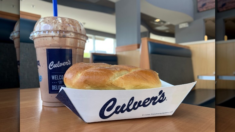 A Culver's fish sandwich and chocolate Concrete Mixer at a restaurant