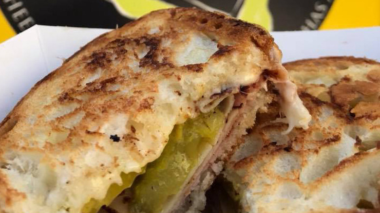 Classic Grilled Cheese sandwich with ham, turkey, and pickles