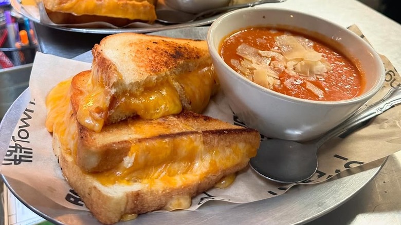 lineup of grilled cheese sandwiches and tomato soup