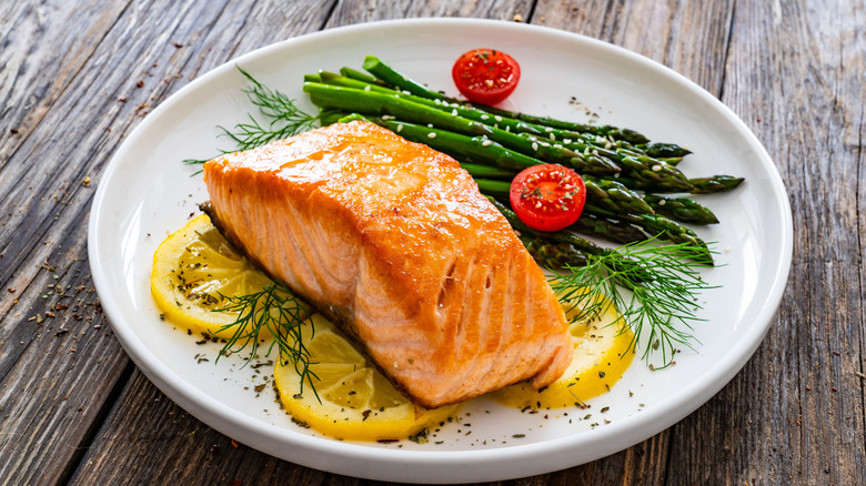Salmon and asparagus on a white plate