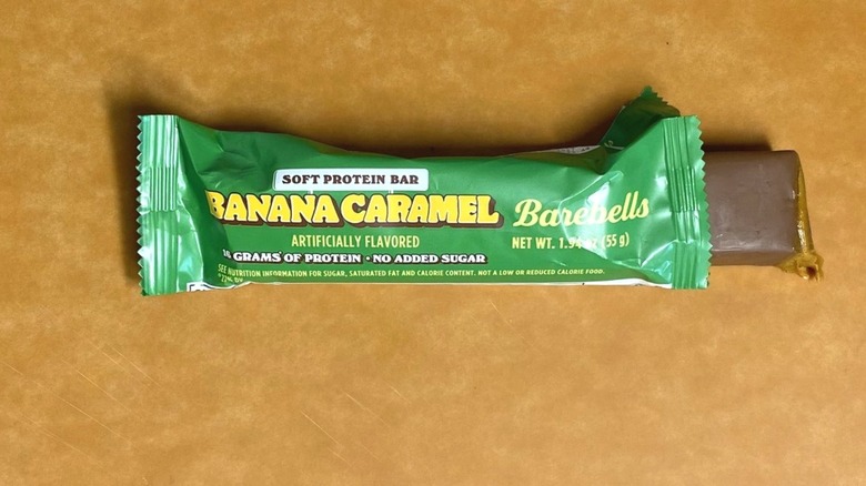 a Banana Caramel Barebells protein bar inside its packaging