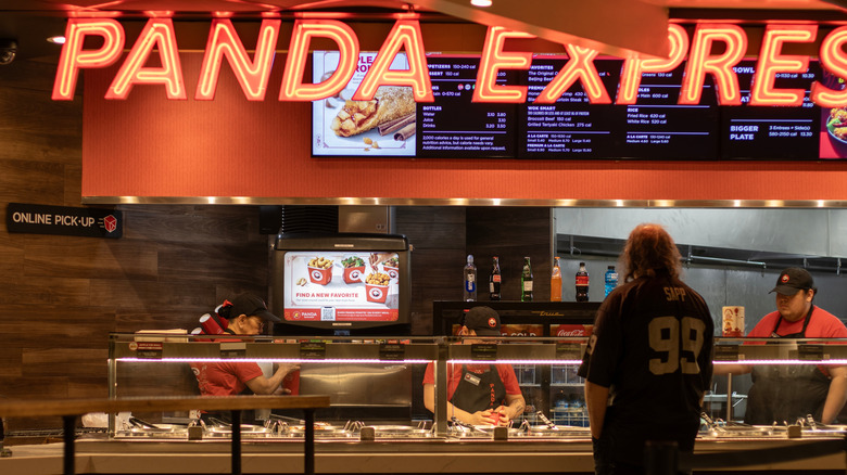 A man orders Panda Express at the mall
