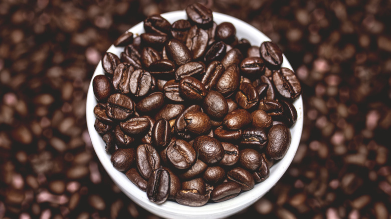 Coffee beans in a white cup