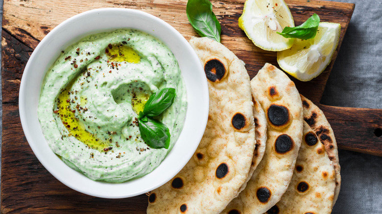 Herby whipped dip with basil, lemon, and grilled flatbreads