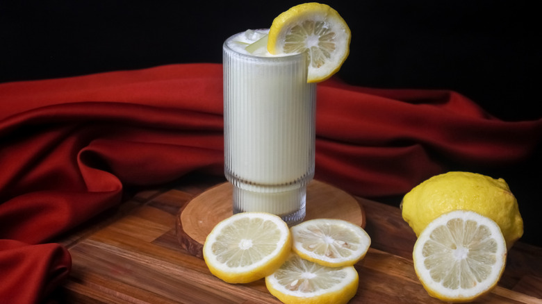 A glass of frothy lemon-based drink