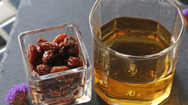 whiskey-soaked raisins next to a shot of whiskey