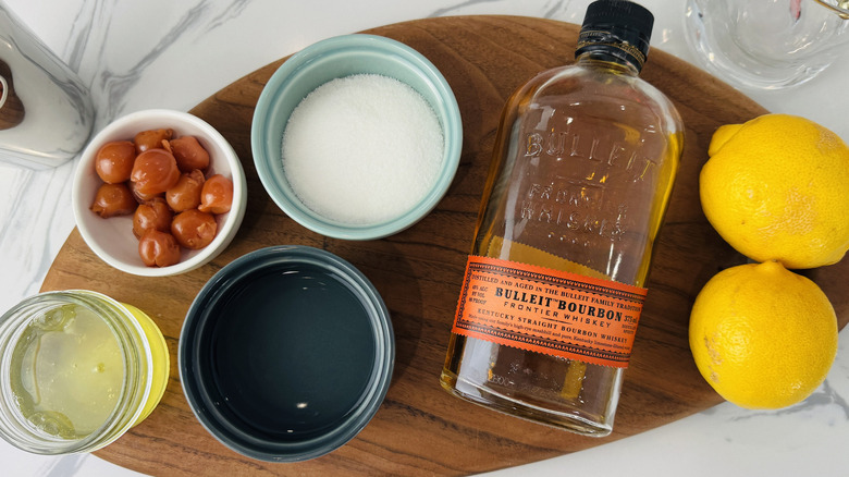 Ingredients for whiskey sour cocktail with egg white foam