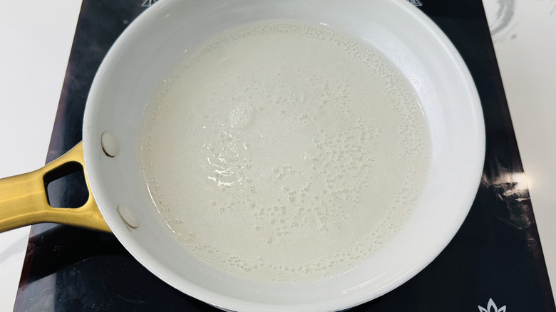 Simple syrup simmering in pan