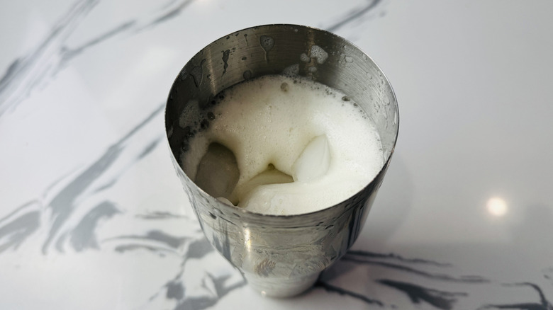 Ice in cocktail shaker for whiskey sour