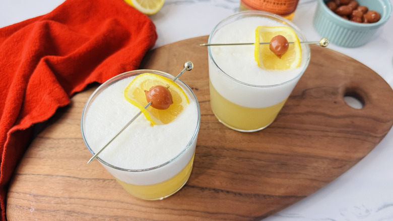 Whiskey sour cocktail with egg white foam