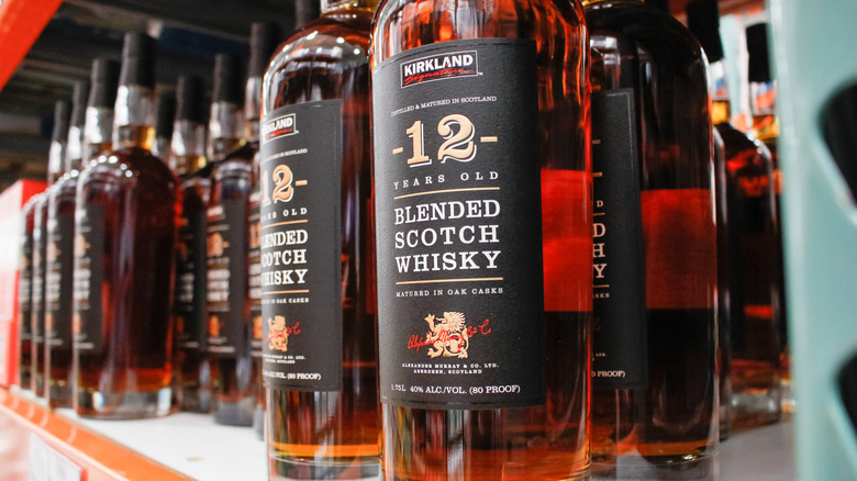 A display of Kirkland Signature 12-Year Blended Scotch Whisky on Costco shelves