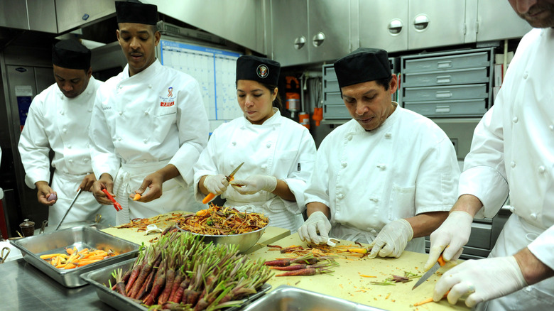Chefs prepping vegetables in the kitchen at the White House