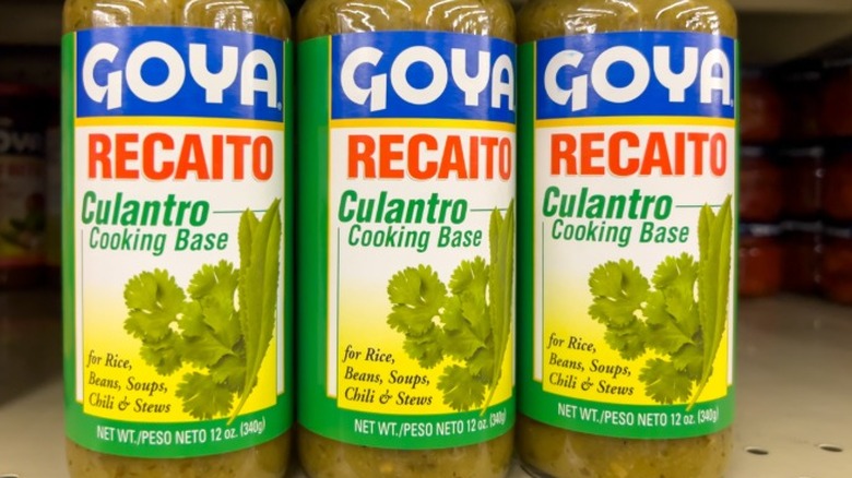Jars of Goya recaito lined up on a store shelf.