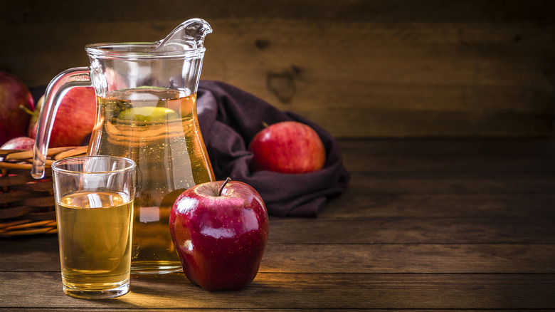 Pitcher, glass of apple juice