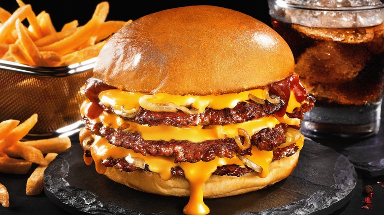 triple decker smash burger with American cheese and fries