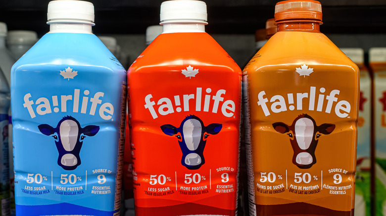 Fairlife milk bottles lined alongside each other on a shelf