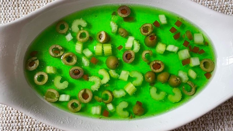 Celery and olives suspended in lime Jell-O