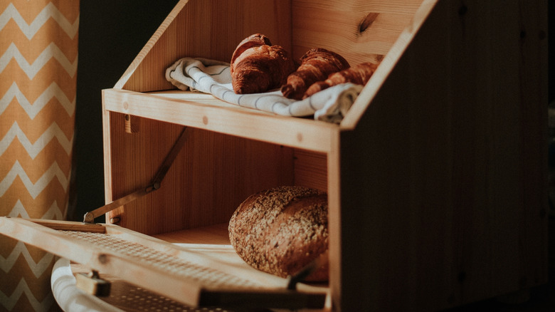 Close up photo of a wooden breadbox