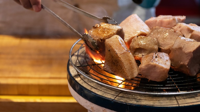Searing sous vide meat over fire