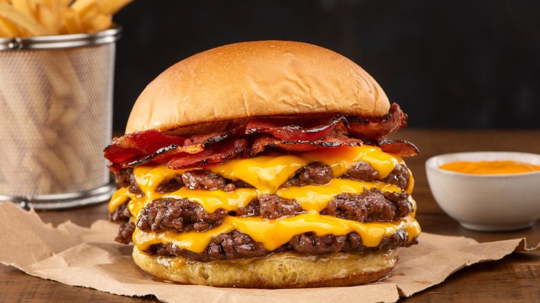 triple smashburger with cheese and bacon