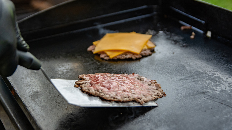 smash burger on grill