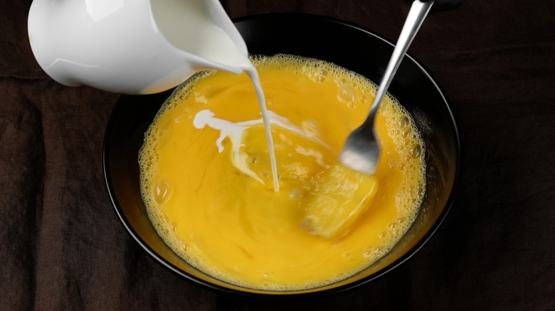 Whisking eggs with milk
