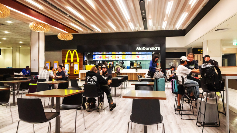 Patrons in an airport McDonald's