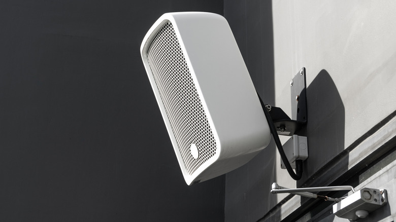 A speaker installed on a restaurant wall.