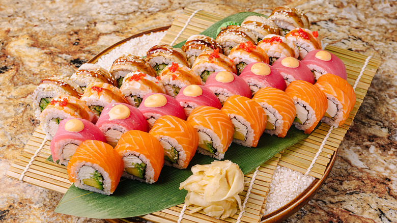 An exquisite sushi platter carefully arranged on a bamboo mat