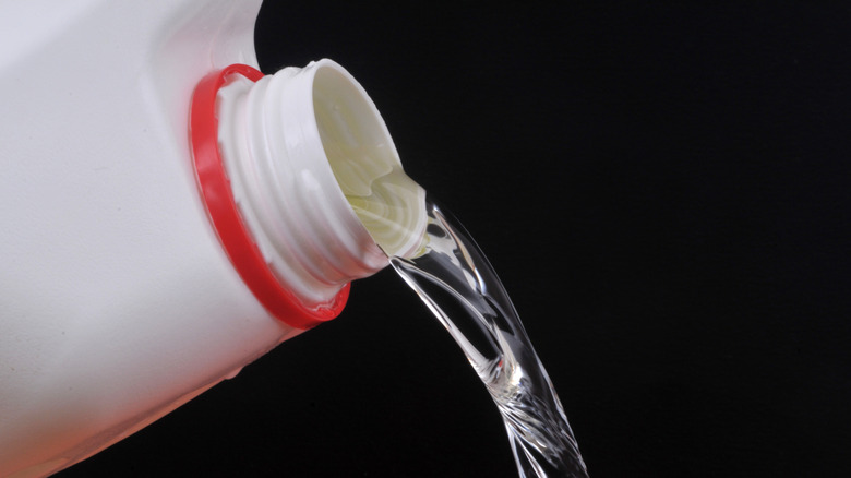 Bleach being poured out of a bottle