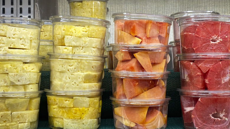 Cut fruit in containers on a grocery store shelf