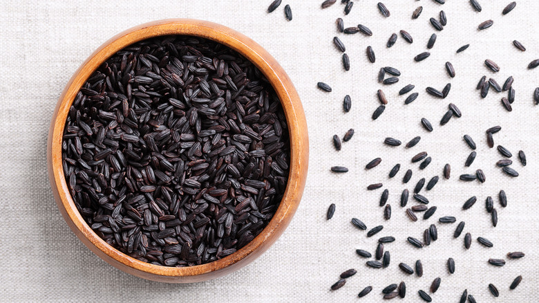 Black rice serves in a wooden bowl