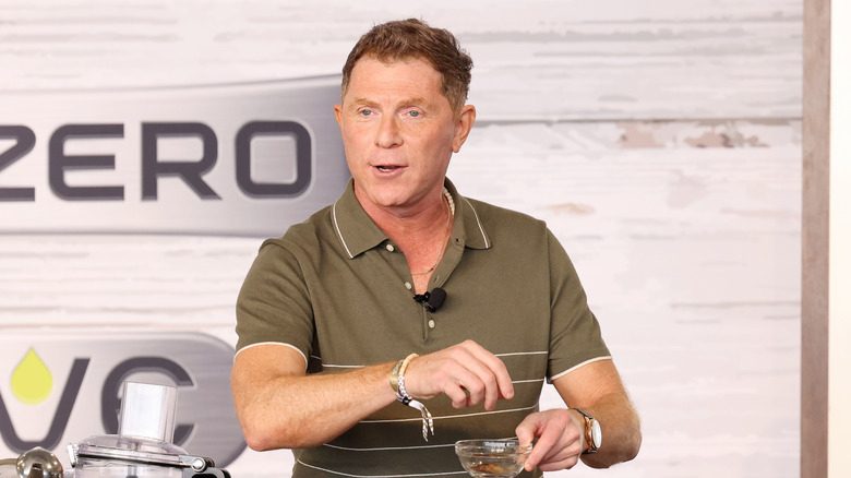 Calebrity chef Bobby Flay talking at a live cooking demonstration.