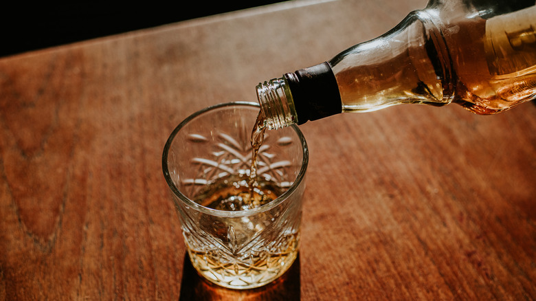 Pouring bourbon into glass