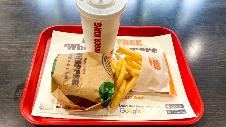 A Burger King meal with fries and a drink.
