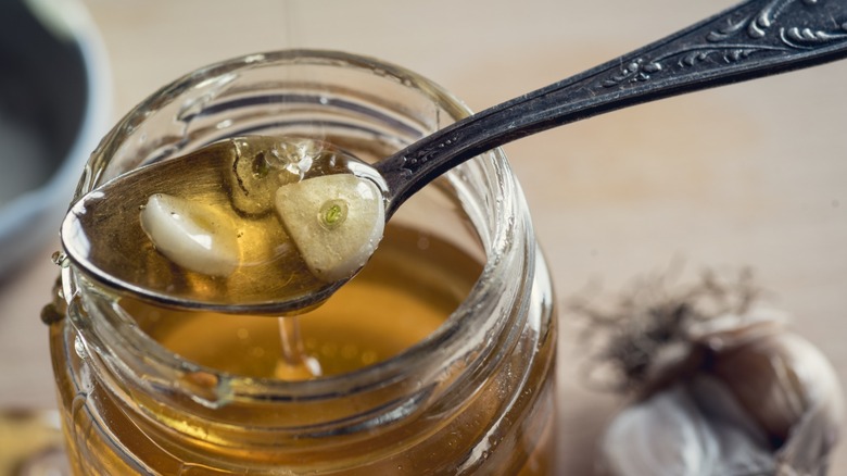 open jar of fermented garlic honey