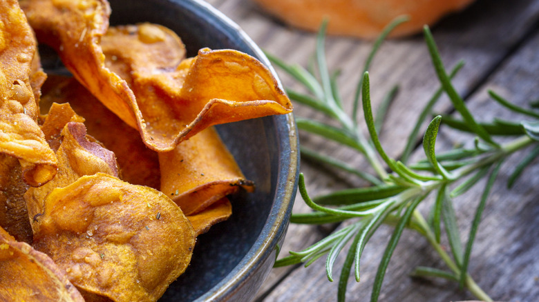 Crunchy chicken chips in a blue bowl