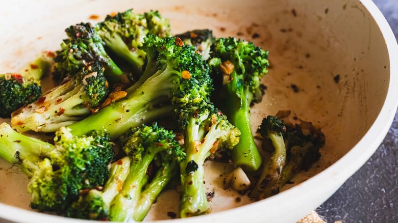 Garlic broccoli stir fry in a white bowl