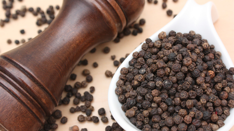 A classic turned wood pepper grinder.