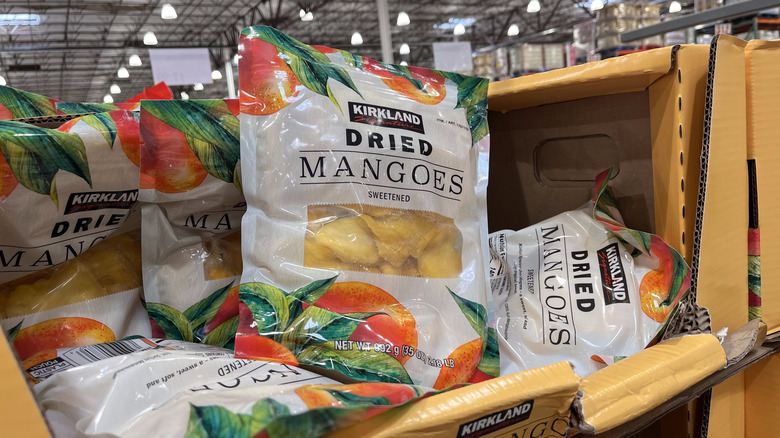 Display boxes with bags of the new sweetened dried mangoes found at Costco.
