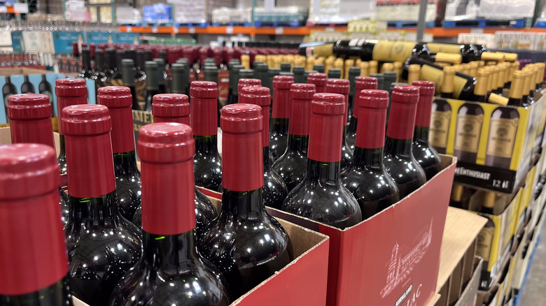 Bottles of wine on shelves in Costco.