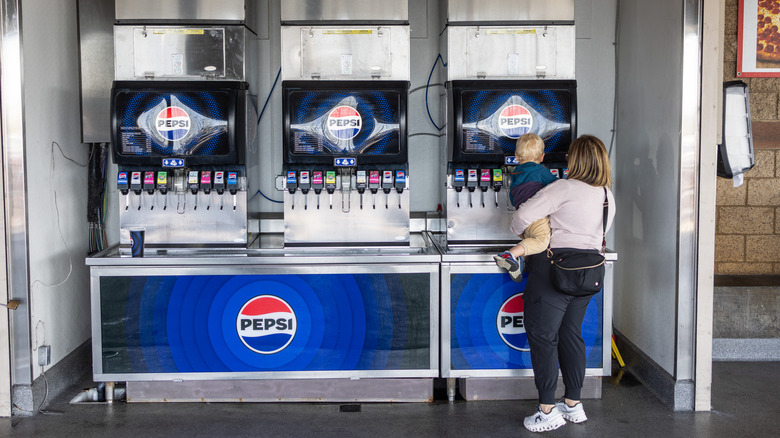 Woman and child getting soda at the Costco food court