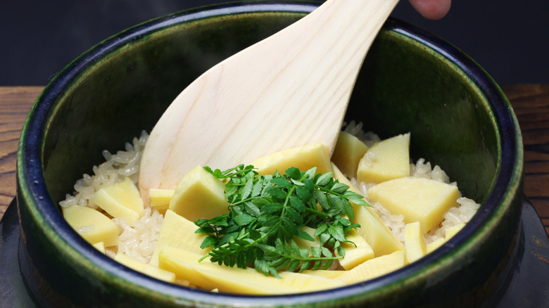 Making a rice dish in a donabe.
